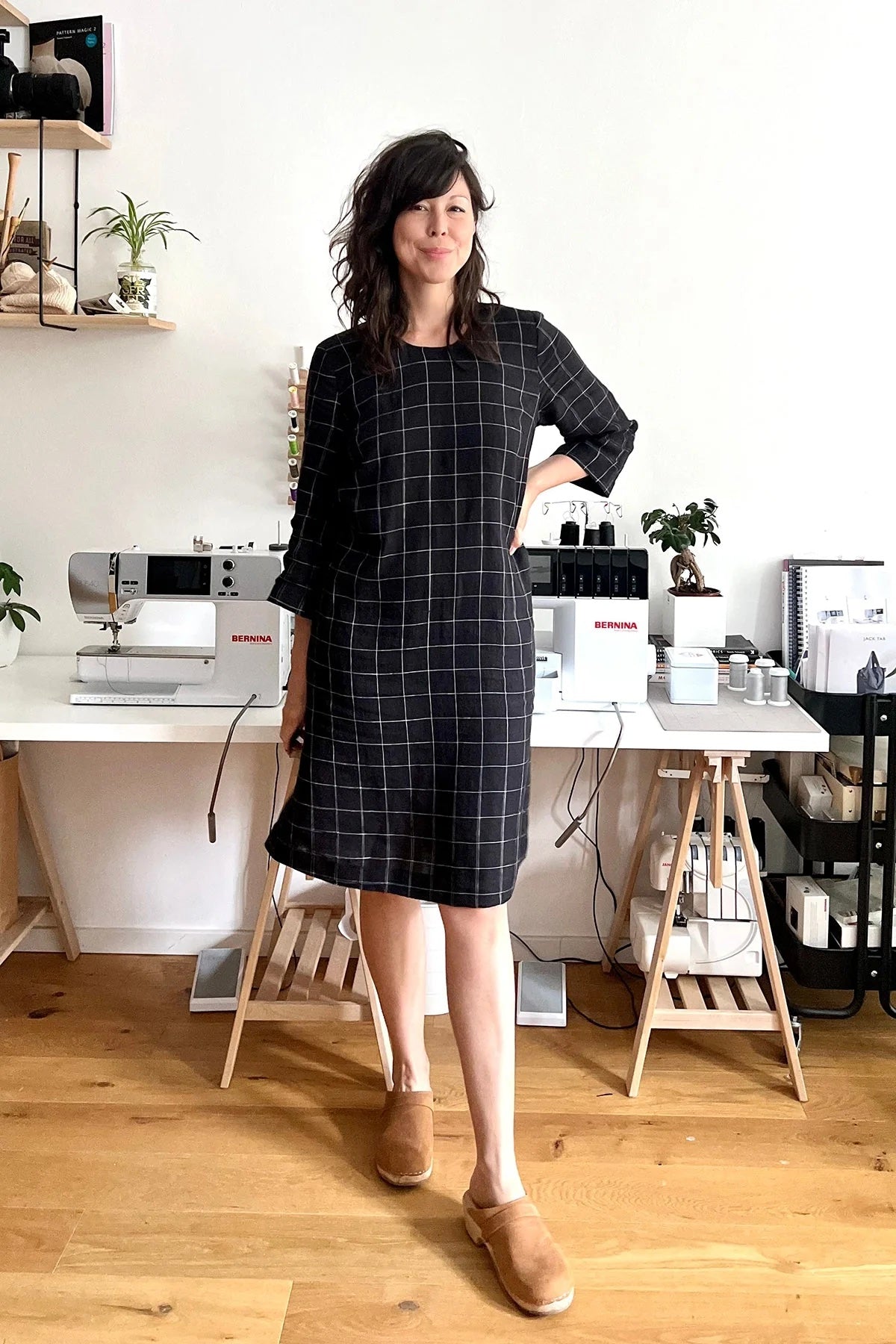 Woman wearing the Cartwright Dress sewing pattern from In the Folds on The Fold Line. A dress pattern made in linen, linen blend, cotton, chambray, denim, or wool fabric, featuring a relaxed fit, round neckline, bust darts, three-quarter length sleeves, and knee length.