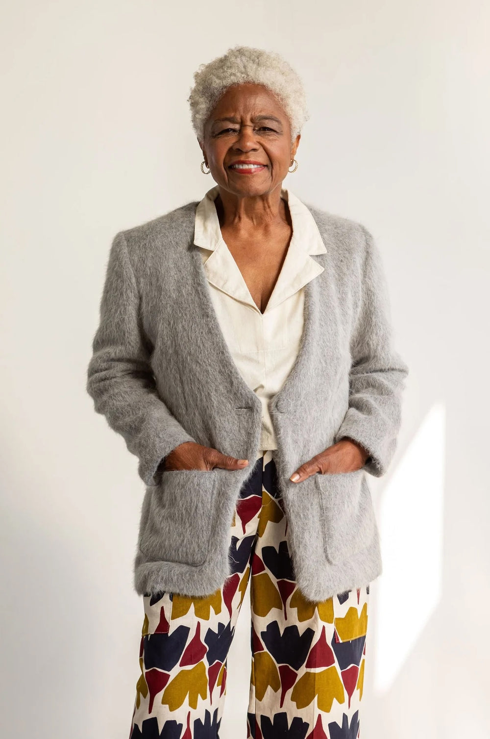 Woman wearing the Eddy Cardigan Blazer sewing pattern from Friday Pattern Company on The Fold Line. A collarless blazer pattern made in linen, suiting, twill, denim, or canvas fabric, featuring a lining, body darts, front patch pockets, a front button, and back vent.